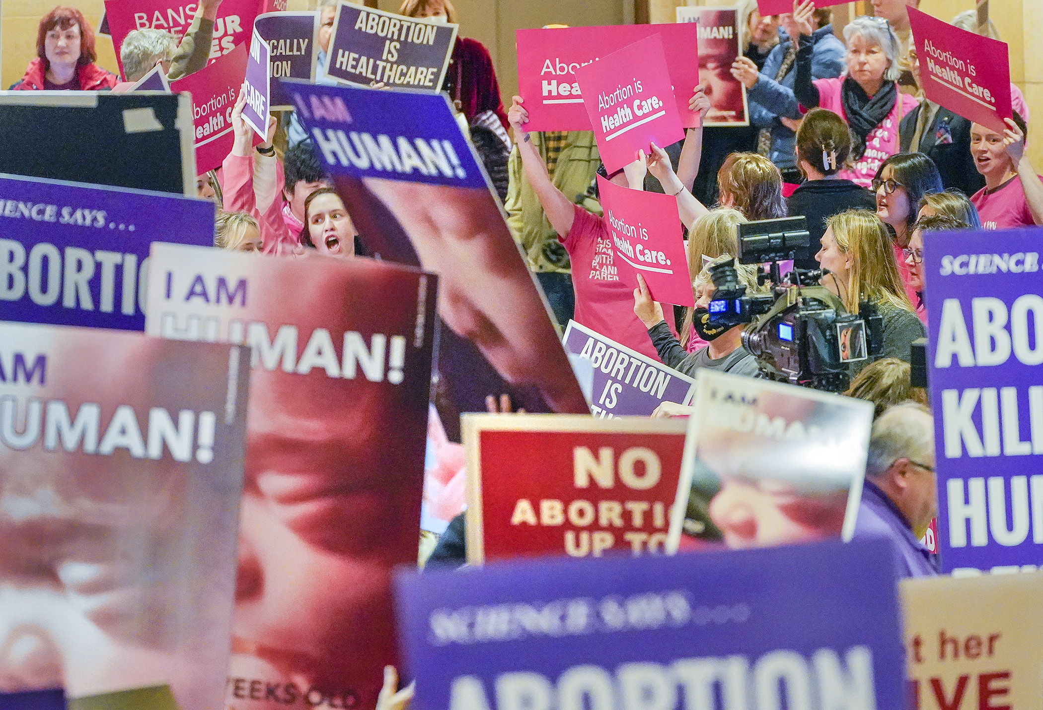 Supporters of reproductive freedom crowded next to abortion opponents in front of the House Chamber Jan. 19 as members inside debated HF1, legislation that would codify the right to an abortion in Minnesota. (Photo by Andrew VonBank)